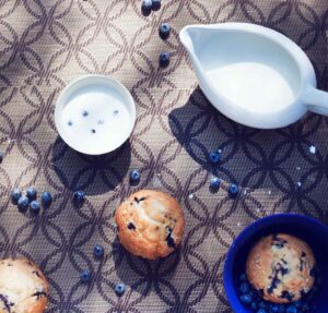 blueberry muffins with blueberries and cream